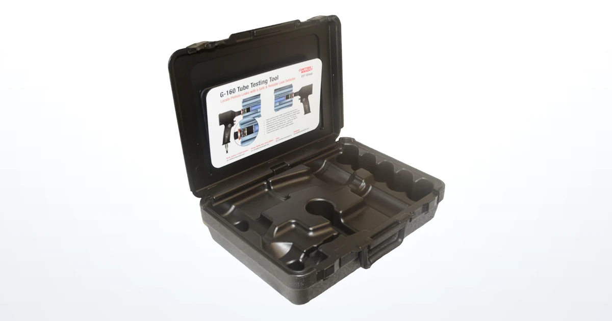 An open carrying case with a molded fitted interior and a printed instruction label in the lid