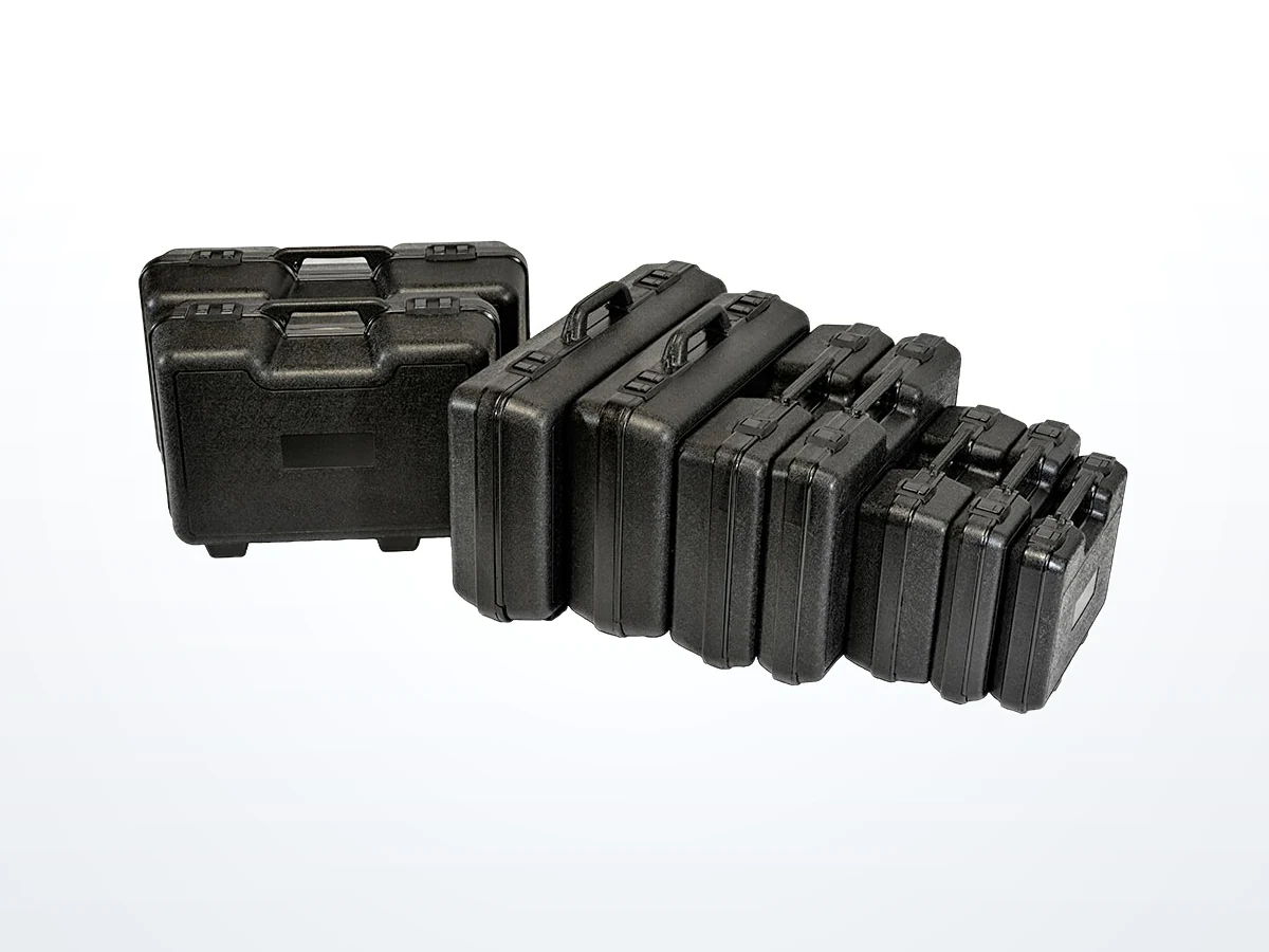 A row of black double-wall Blow Molded carrying cases in graduated sizes, largest to smallest
